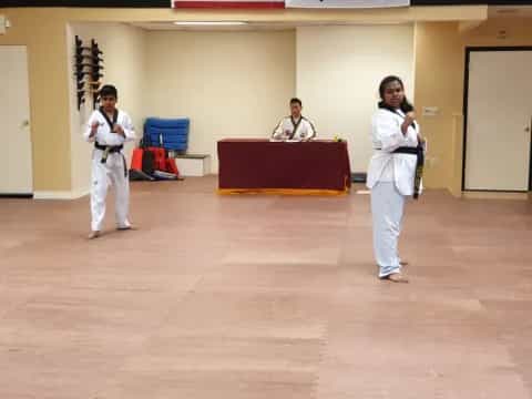 a group of people in karate uniforms