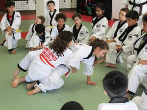 a group of people in karate uniforms