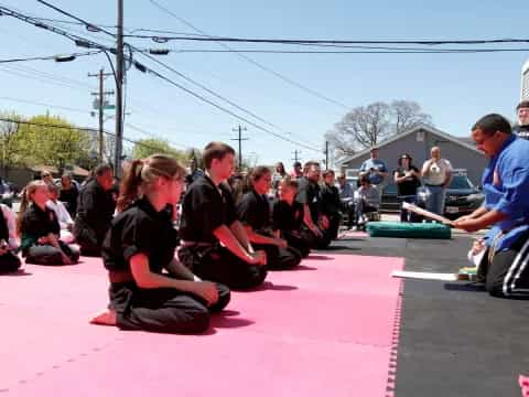 a group of people sitting on the ground