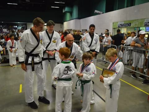 a group of people in karate uniforms