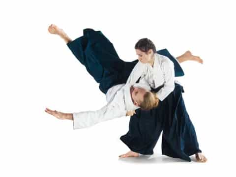 a man and a woman in black karate uniforms