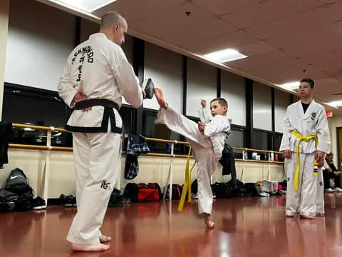 a group of people in karate uniforms
