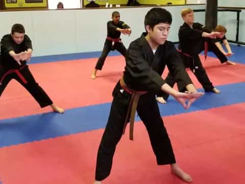 a group of people in a martial arts class