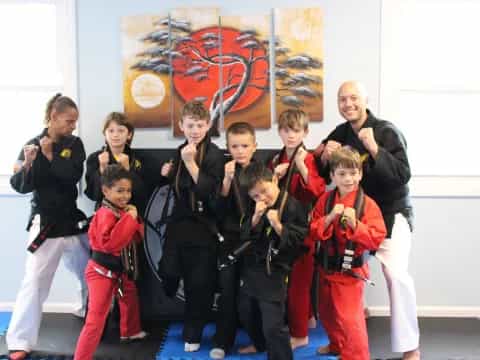a group of people in karate uniforms