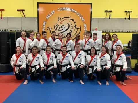 a group of people in uniforms posing for a photo