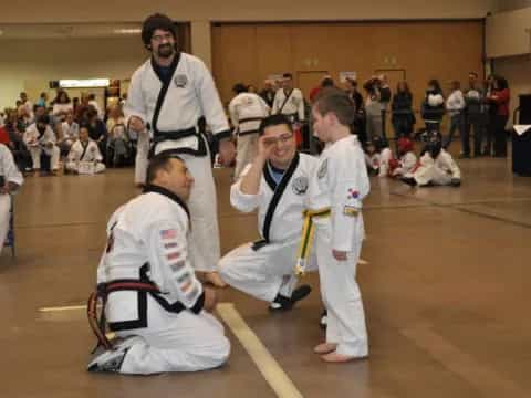 a group of people in karate uniforms
