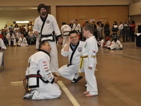 a group of people in karate uniforms