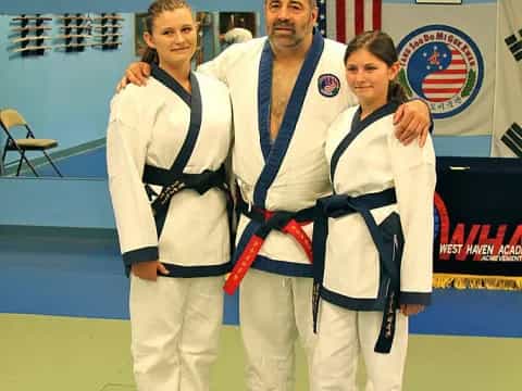 a group of people in karate uniforms