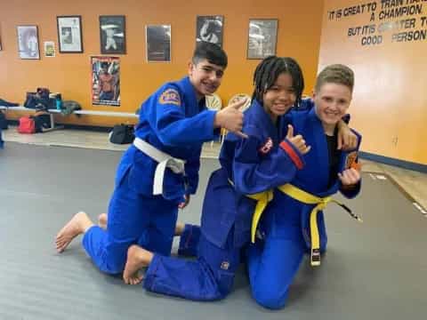 a group of people in blue karate uniforms