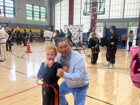 a person and a boy posing for a picture