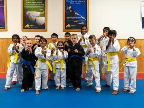 a group of people in karate uniforms