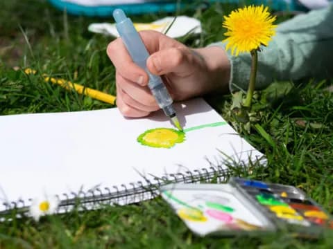 a person writing on a piece of paper