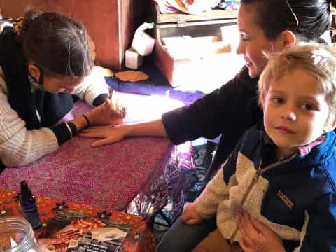 a group of children sitting at a table