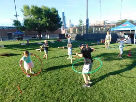 a group of kids playing in a field