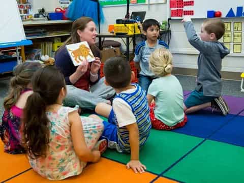 a group of children sitting on the floor
