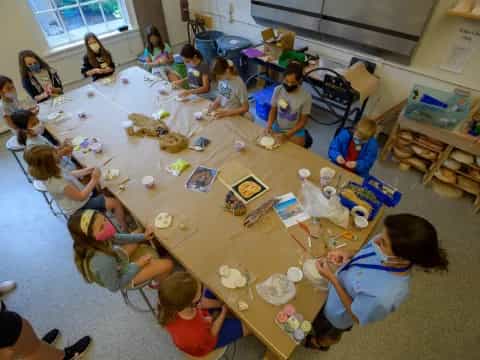 a group of people sitting around a table