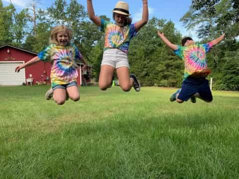 a group of children jumping in the air
