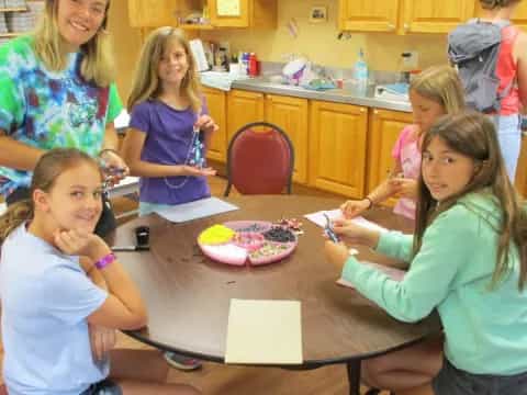 a group of children around a table