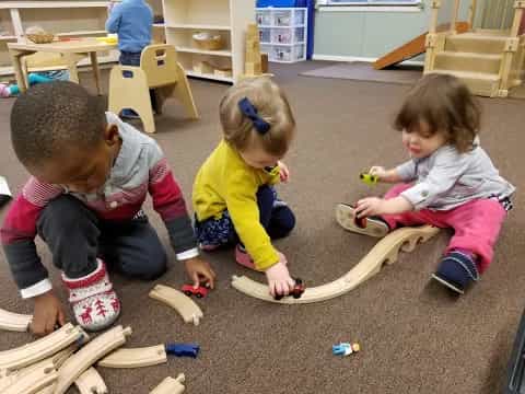 a group of children playing with toys