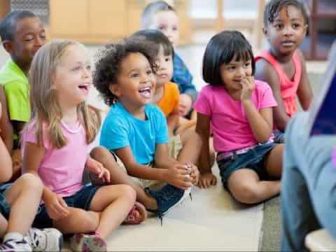 a group of children sitting on the floor