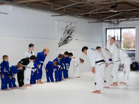 a group of people in karate uniforms