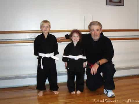 a man and two children posing for a photo