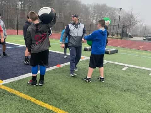 a group of people on a football field