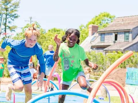 a group of children playing in a playground