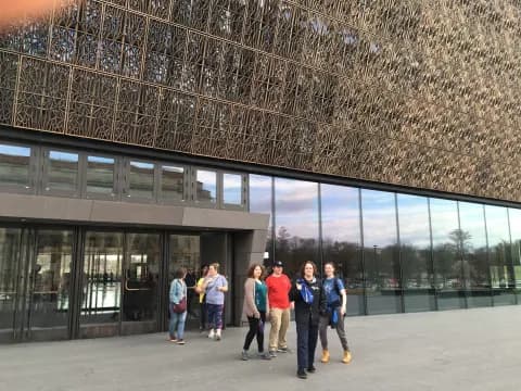 a group of people standing outside a building