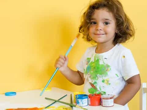 a young girl painting