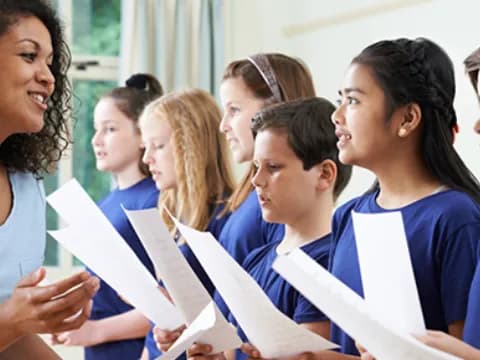 a group of women looking at a paper