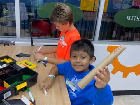 a person and a boy playing with a toy