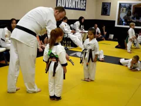 a group of people in karate uniforms