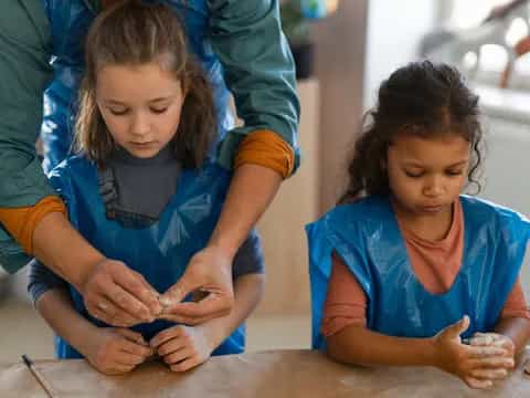 a few young girls working on a project