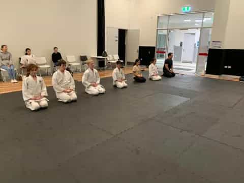 a group of people sitting on the floor
