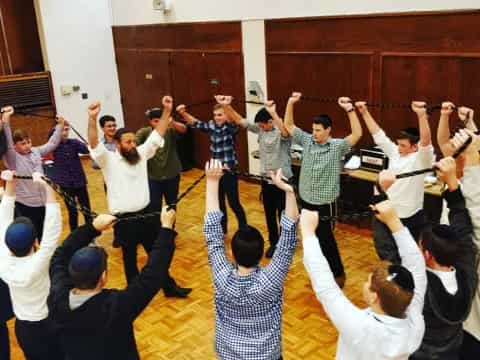 a group of people raising their hands