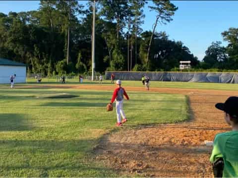 a group of people playing baseball