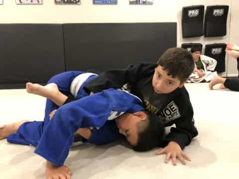 a couple of boys lying on the floor
