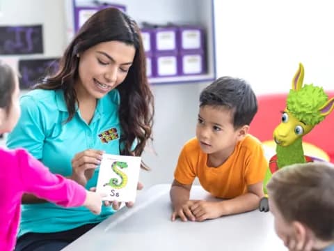 a person and children looking at a paper