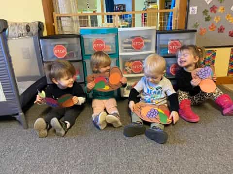 a group of children sitting on the floor