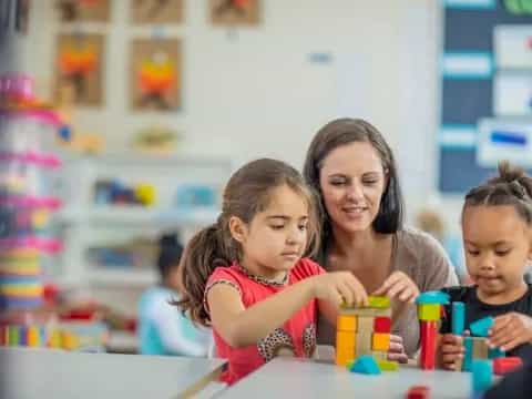 a person and children playing with toys