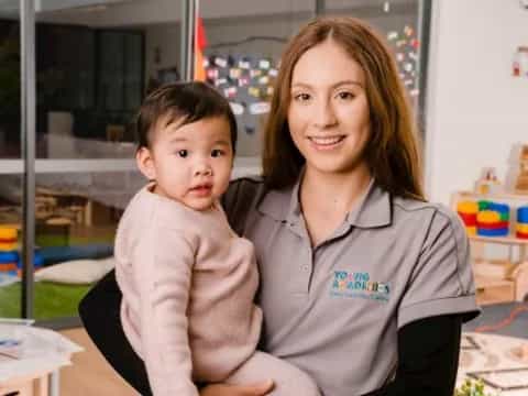 a person and a child posing for the camera
