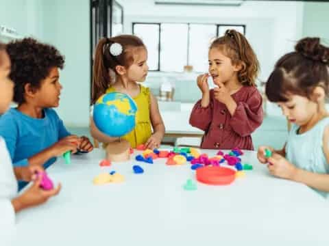 a group of children playing with toys