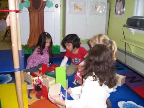 a group of children playing with toys