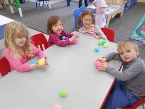 a group of children sitting on the floor
