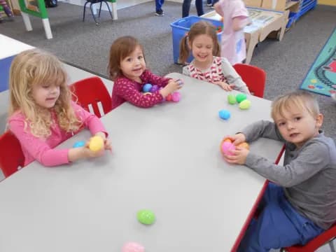 a group of children sitting on the floor