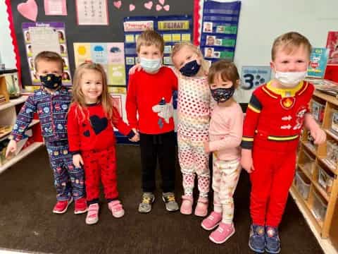 a group of children wearing clothing