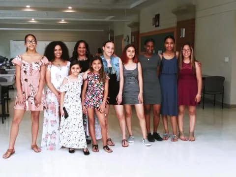 a group of women posing for a photo