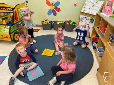 a group of children sitting on the floor