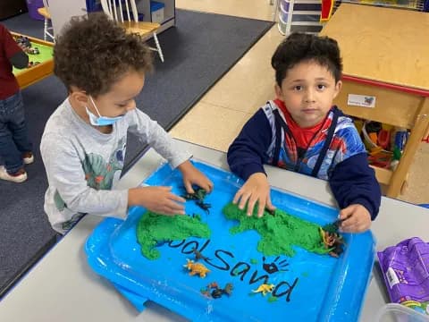 a couple of boys playing with a toy
